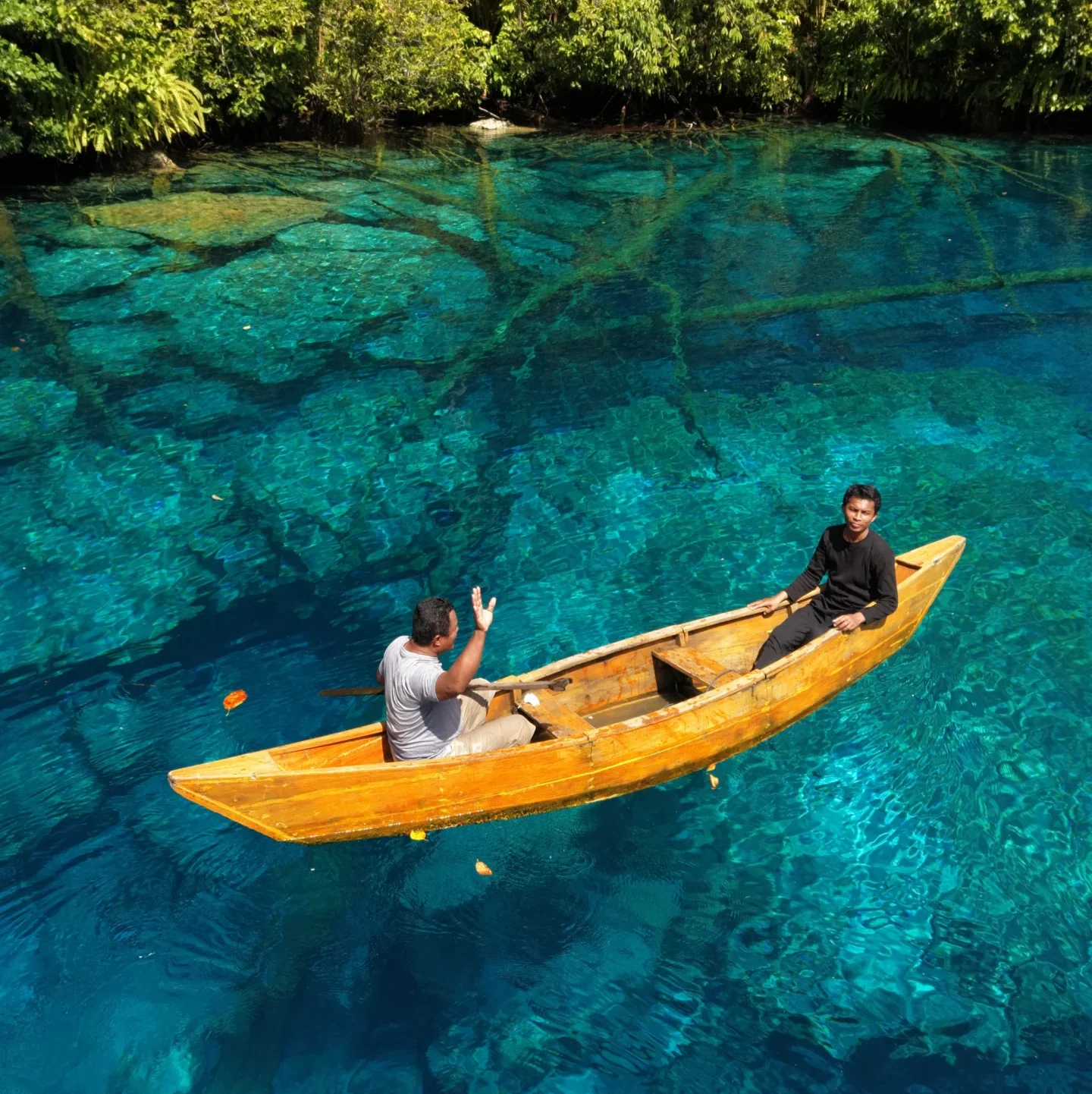 Tourists kayaking at Paisupok Lake Banggai Central Sulawesi