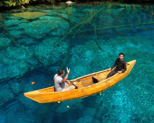 Tourists kayaking at Paisupok Lake Banggai Central Sulawesi